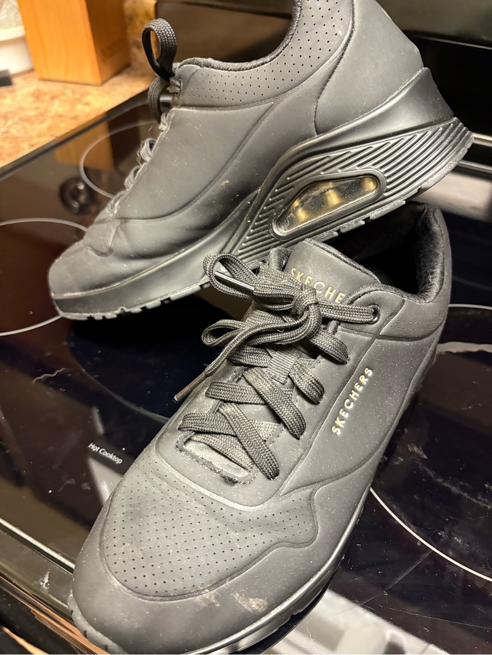 Skechers Women’s Black Athletic Sneakers with Subtle Gold Accents